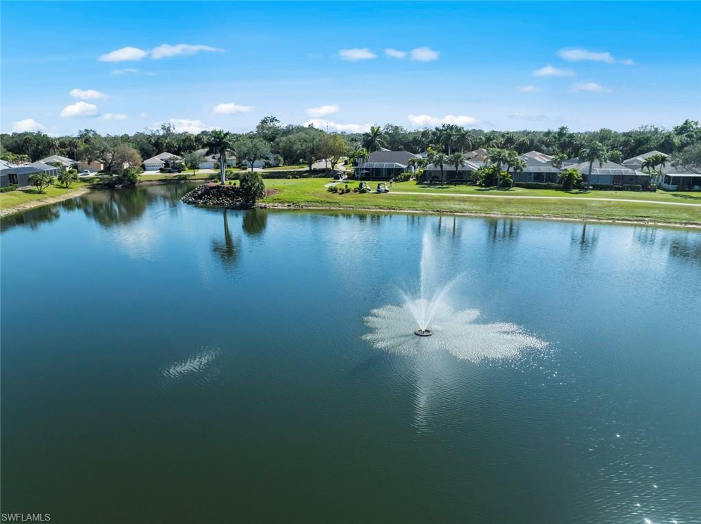 20810 Rivers Ford Estero, FL 33928 - Photo 44 of 49 a view of a lake with houses in the back