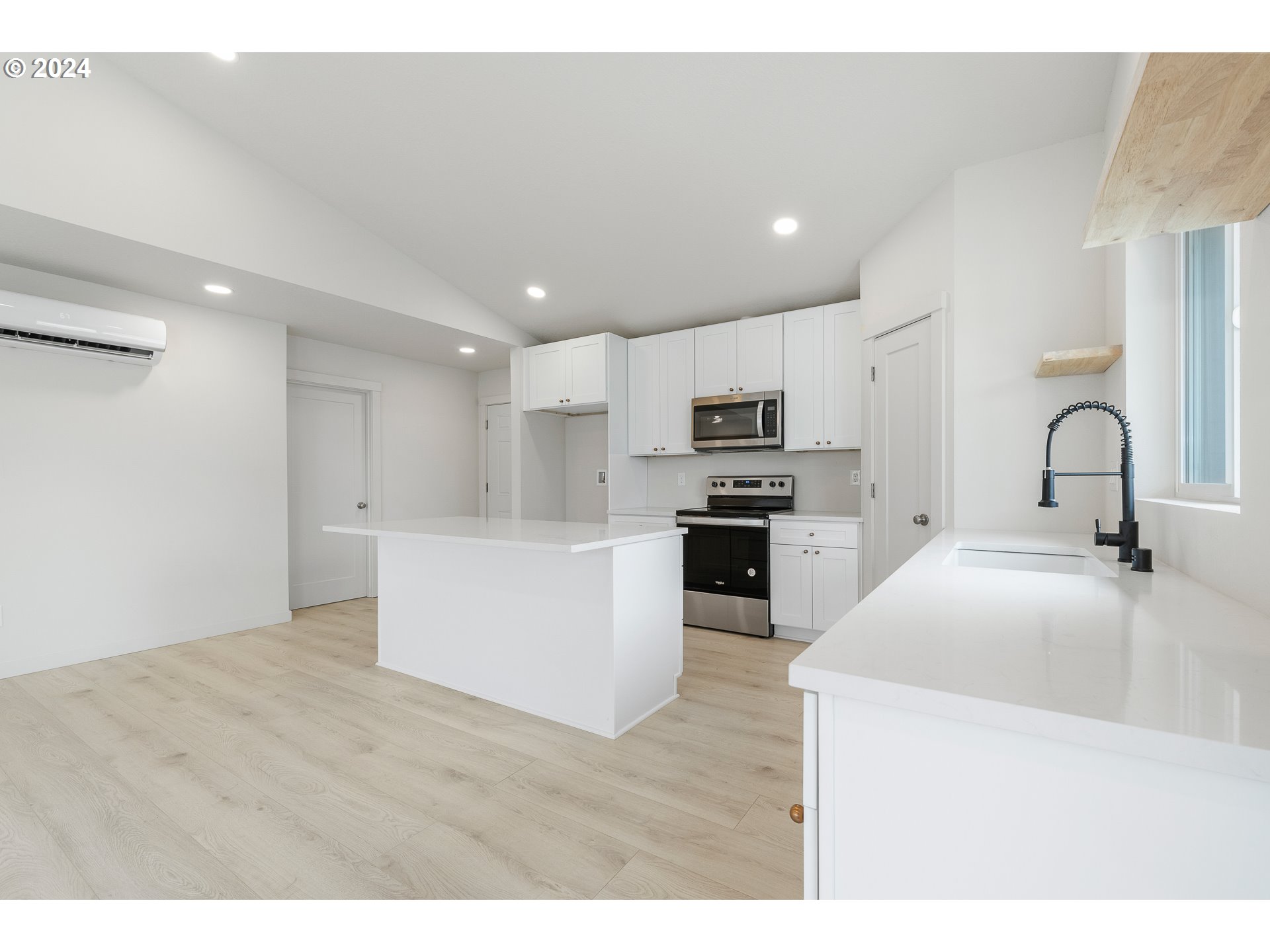 3004 Orange Road Winlock, WA 98596 - Photo 12 of 35 a kitchen with stainless steel appliances kitchen island sink refrigerator and microwave