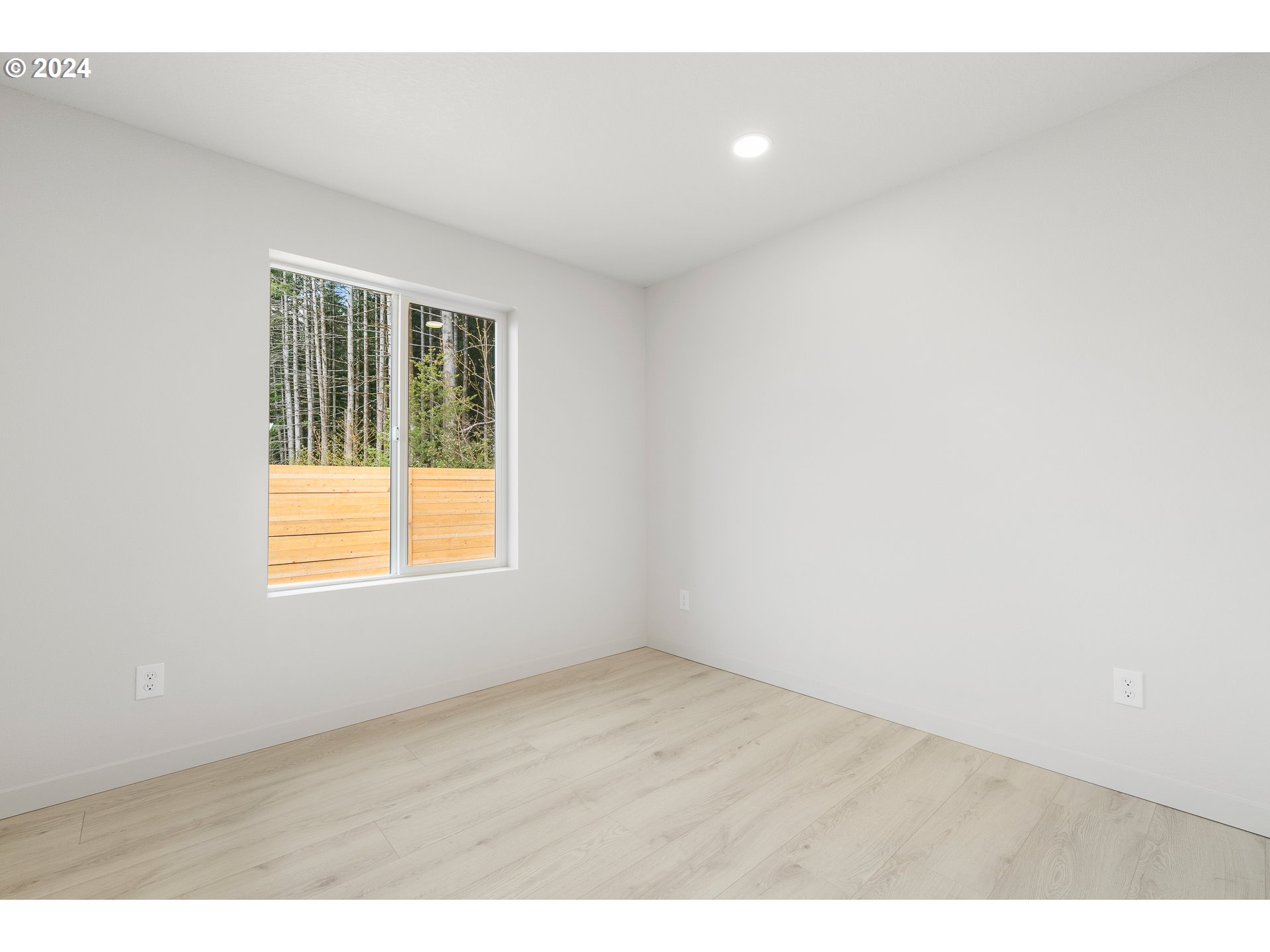 3004 Orange Road Winlock, WA 98596 - Photo 23 of 35 a view of an empty room with wooden floor and a window