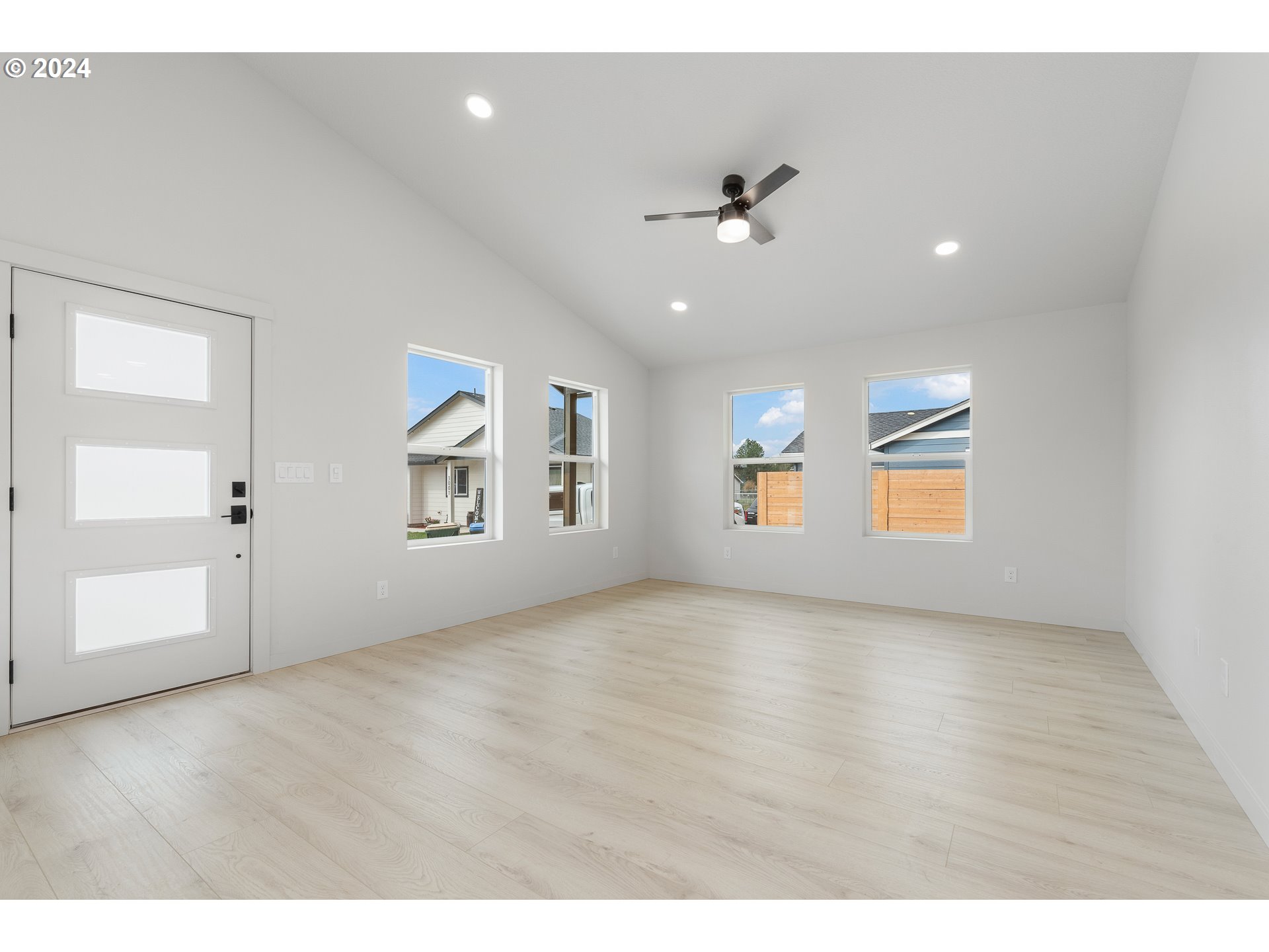 3004 Orange Road Winlock, WA 98596 - Photo 10 of 35 a view of an empty room with a window and wooden floor
