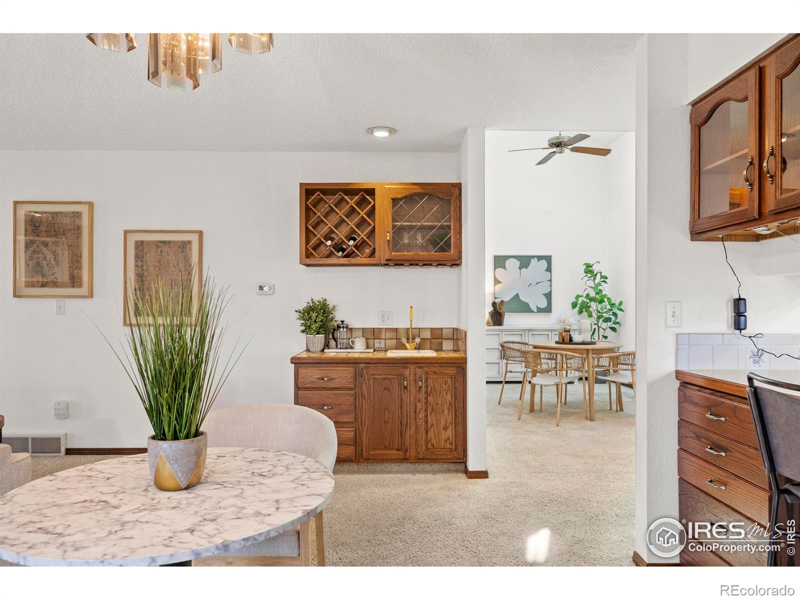 903 Conifer Court Windsor, CO 80550 - Photo 15 of 33 a living room with furniture a potted plant and a table
