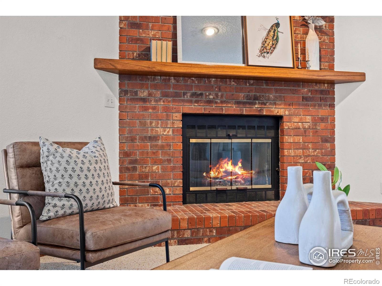 903 Conifer Court Windsor, CO 80550 - Photo 17 of 33 a living room with furniture and a fireplace