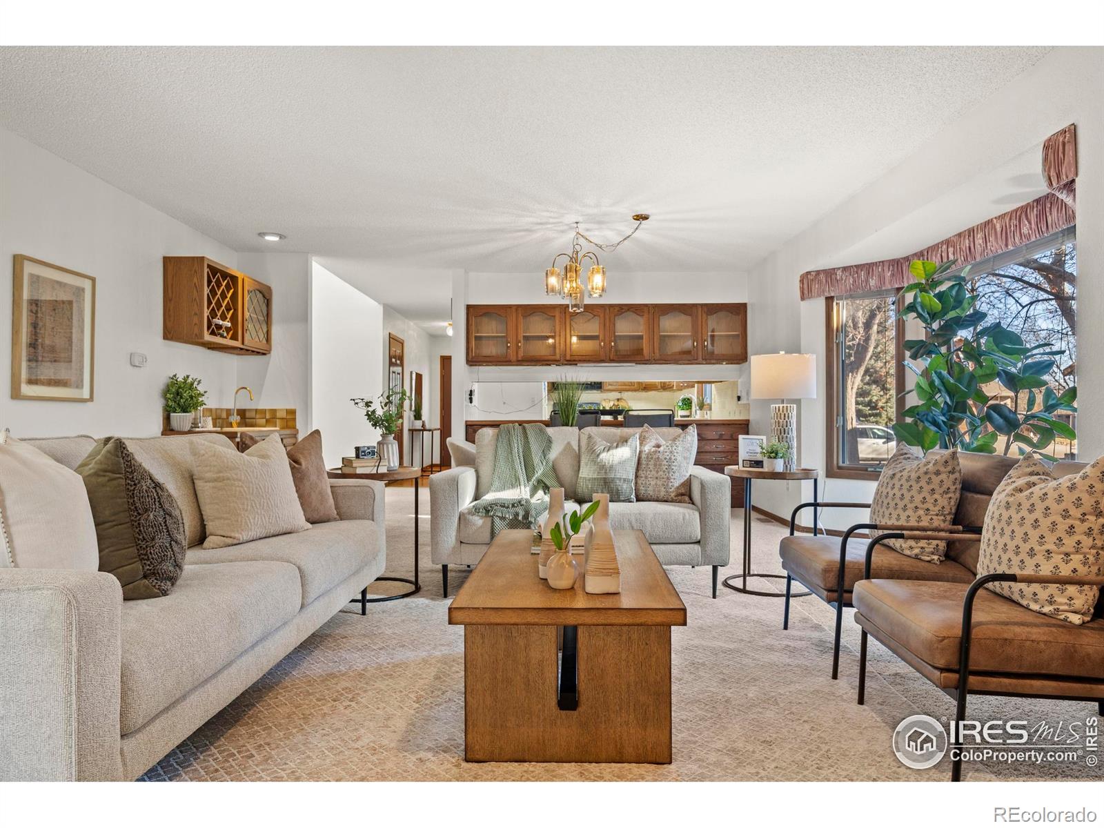 903 Conifer Court Windsor, CO 80550 - Photo 18 of 33 a living room with furniture and a large window