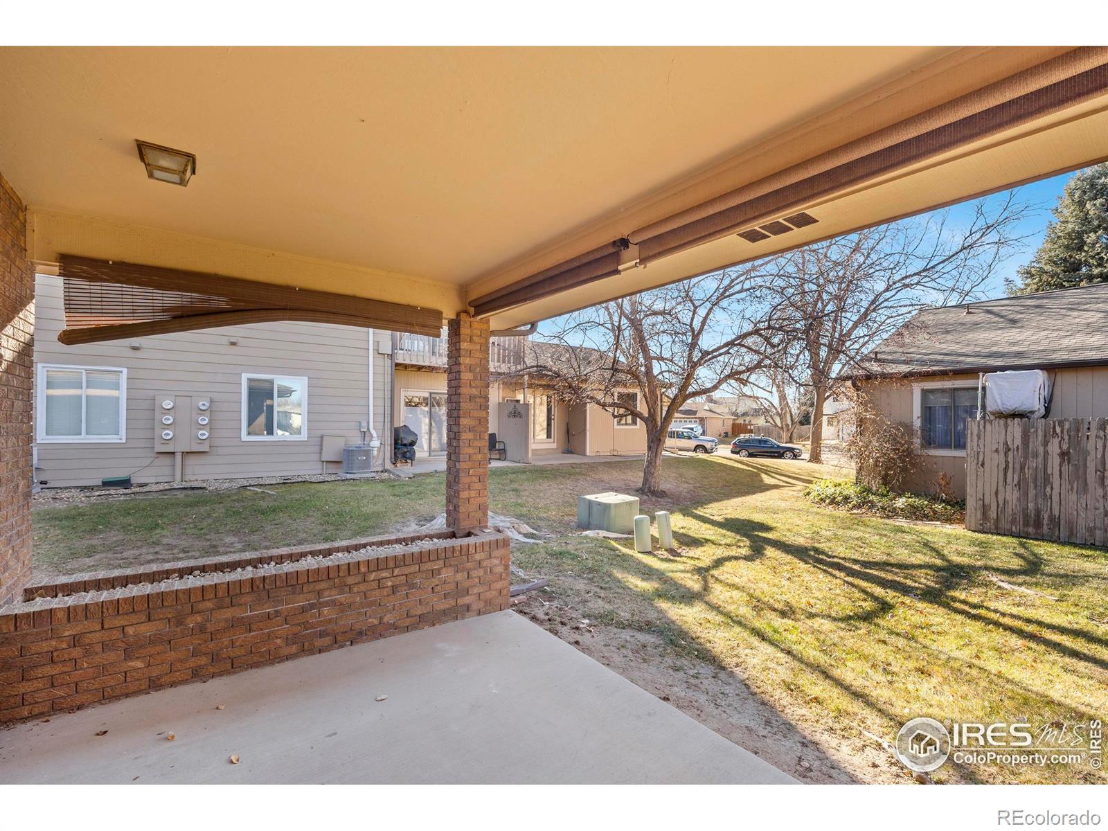 903 Conifer Court Windsor, CO 80550 - Photo 32 of 33 a view of a house with a yard