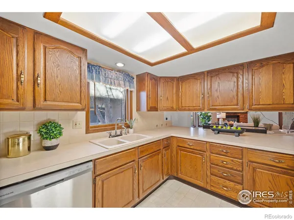 a kitchen with sink cabinets and window