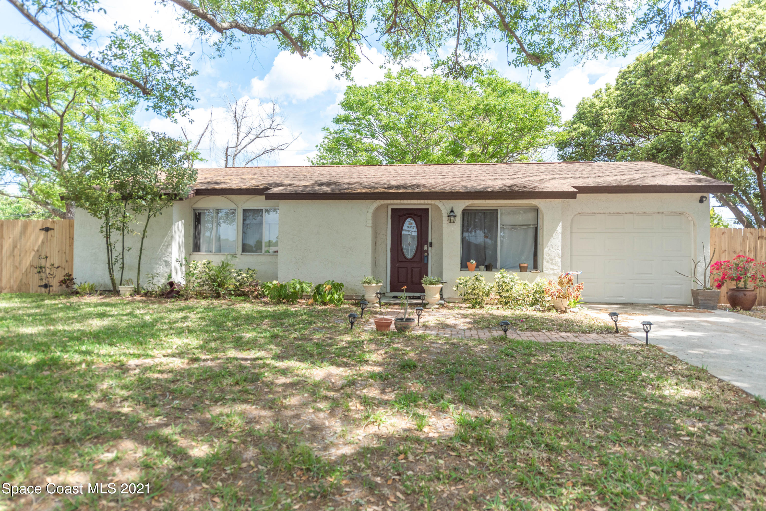 237 Chase Road Cocoa, FL 32927 - Photo 1 of 20 a front view of a house with garden