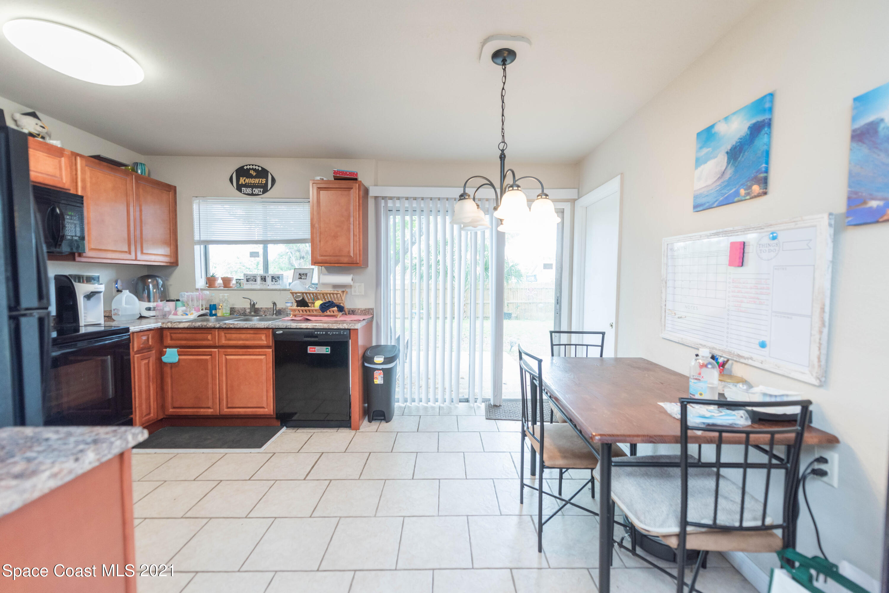237 Chase Road Cocoa, FL 32927 - Photo 10 of 20 a kitchen with stainless steel appliances kitchen island granite countertop a sink and cabinets