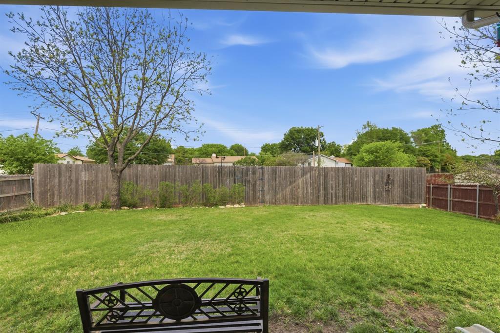 817 Huebner Way Burleson, TX 76028 - Photo 31 of 35 Backyard has a privacy fence, sprinkler system and storage building. The lot goes beyond the fence to give extra privacy from backyard neighbors.