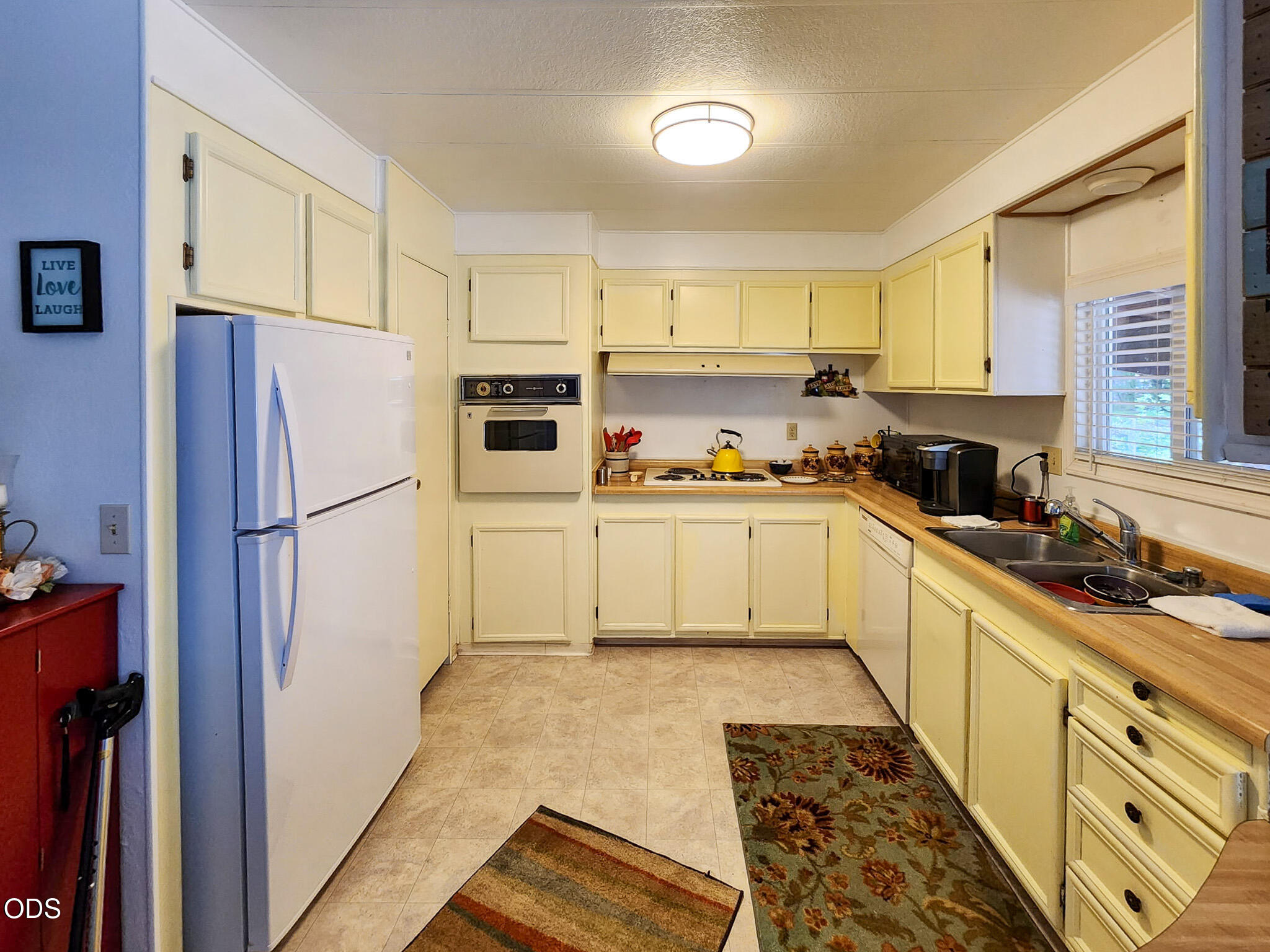350 Hamilton Avenue Cave Junction, OR 97523 - Photo 9 of 34 a kitchen with stainless steel appliances granite countertop a refrigerator sink and cabinets
