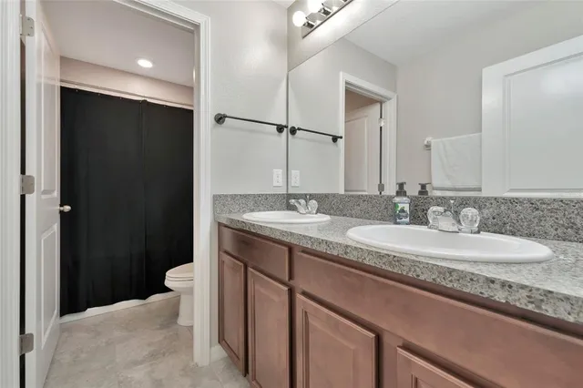 a bed room with a bed and a potted plant