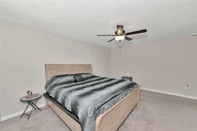 a view of walk in closet with clothes