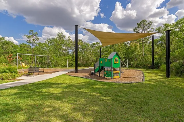 an aerial view of a house with a garden