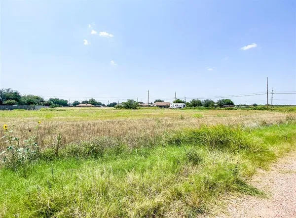 a view of a lake with a big yard