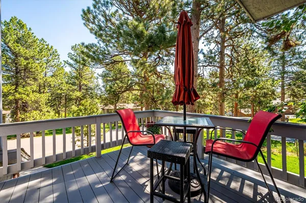 a view of a balcony with furniture