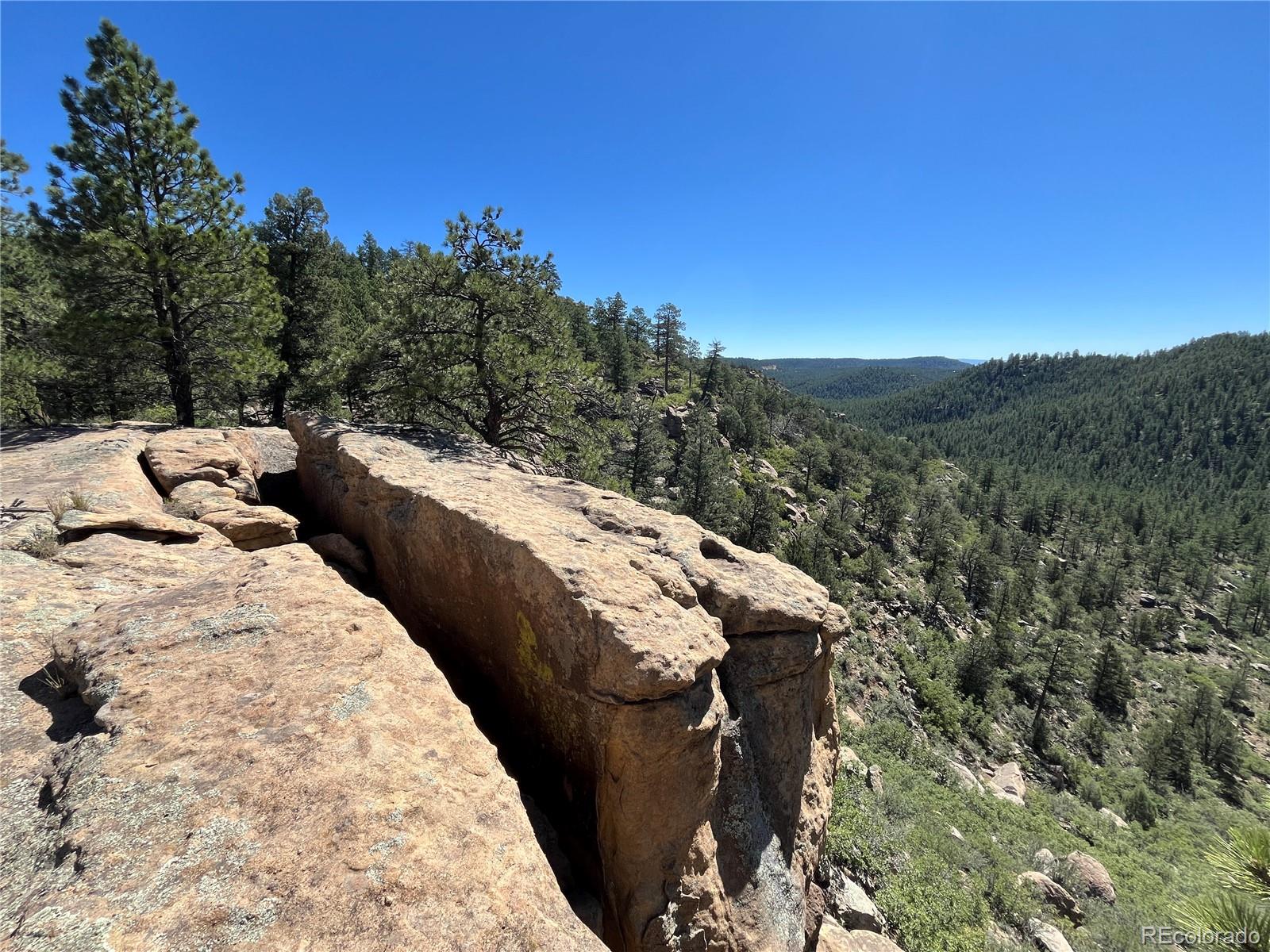 14200 County Road Weston, CO 81091 - Photo 24 of 42 a view of a backyard of the house