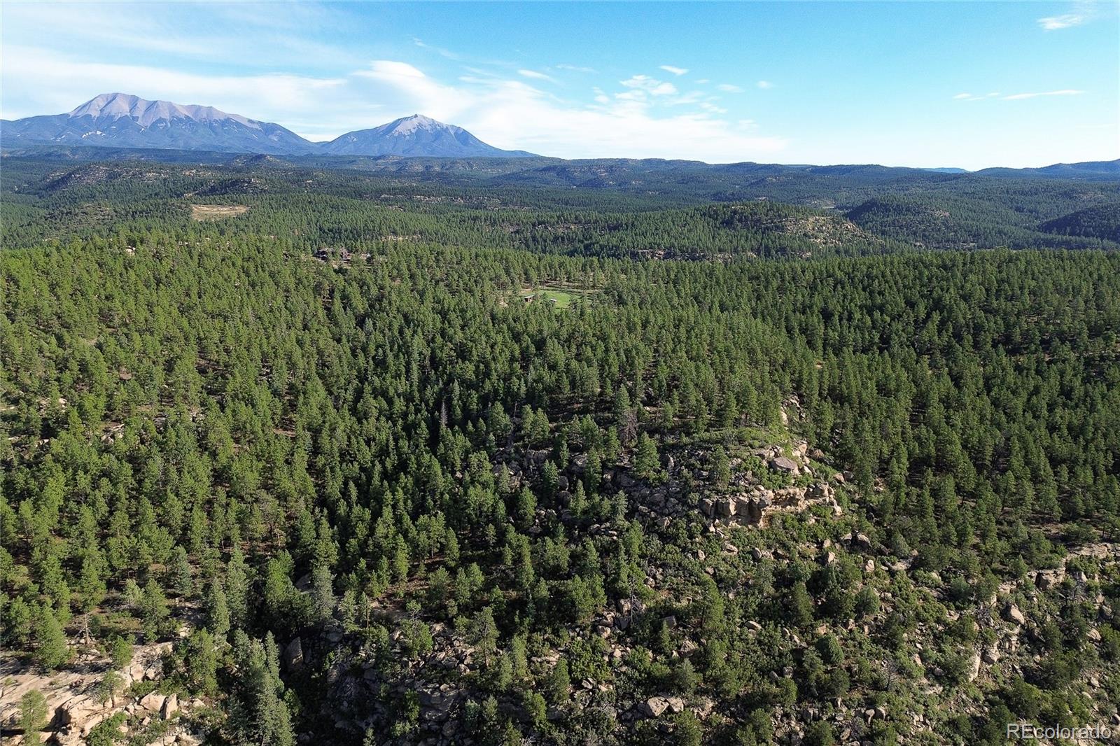 14200 County Road Weston, CO 81091 - Photo 40 of 42 a view of a lush green hillside and a building