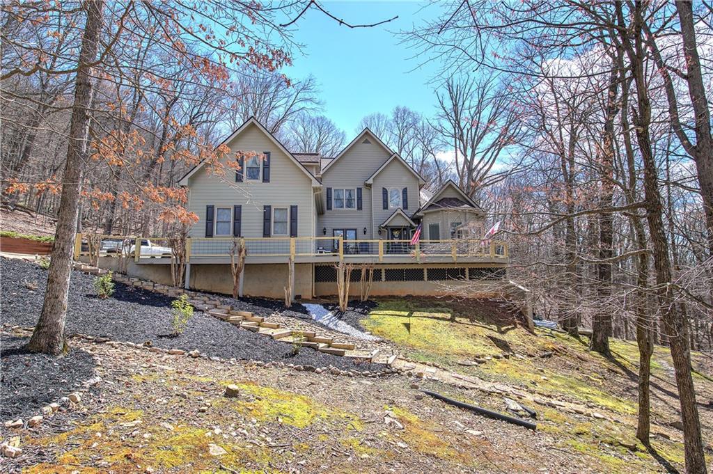 64 Fairview Court Jasper, GA 30143 - Photo 1 of 86 a front view of a house with swimming pool and sitting area