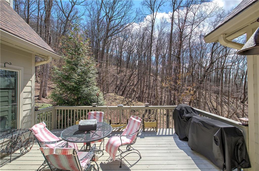 64 Fairview Court Jasper, GA 30143 - Photo 15 of 86 a balcony with wooden floor table and chairs