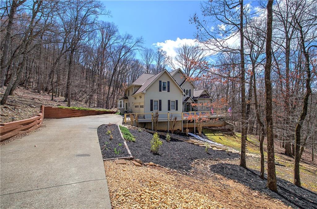 64 Fairview Court Jasper, GA 30143 - Photo 2 of 86 a view of a house with trees in the background