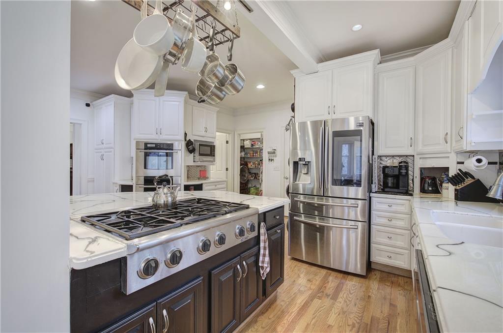 64 Fairview Court Jasper, GA 30143 - Photo 21 of 86 a kitchen with stainless steel appliances a stove a refrigerator and a chandelier