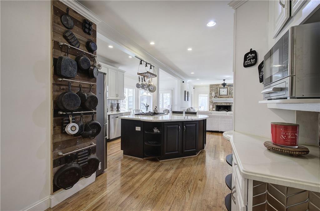 64 Fairview Court Jasper, GA 30143 - Photo 22 of 86 a kitchen with stainless steel appliances granite countertop a stove and a wooden cabinets