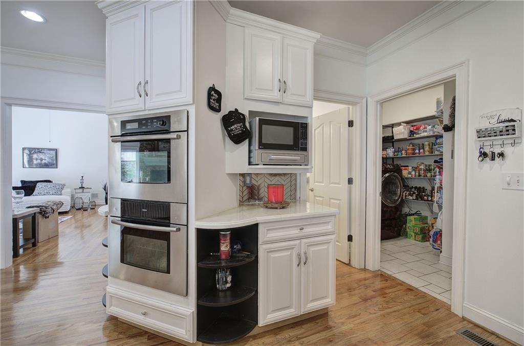 64 Fairview Court Jasper, GA 30143 - Photo 23 of 86 a kitchen with stainless steel appliances kitchen island granite countertop a refrigerator and cabinets