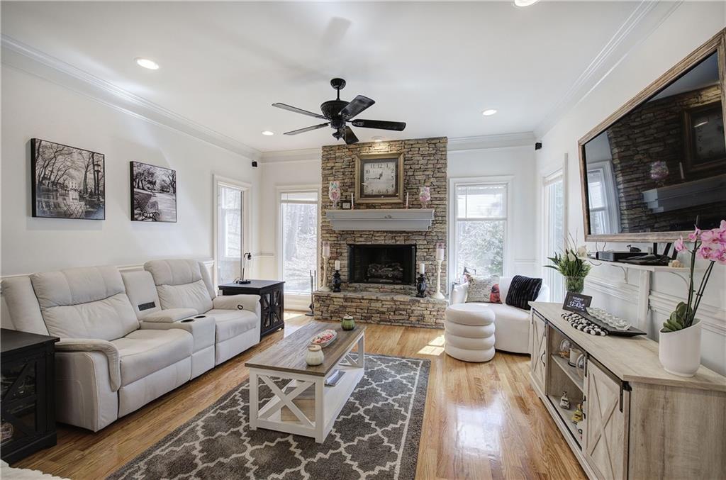 64 Fairview Court Jasper, GA 30143 - Photo 25 of 86 a living room with furniture a flat screen tv and a fireplace