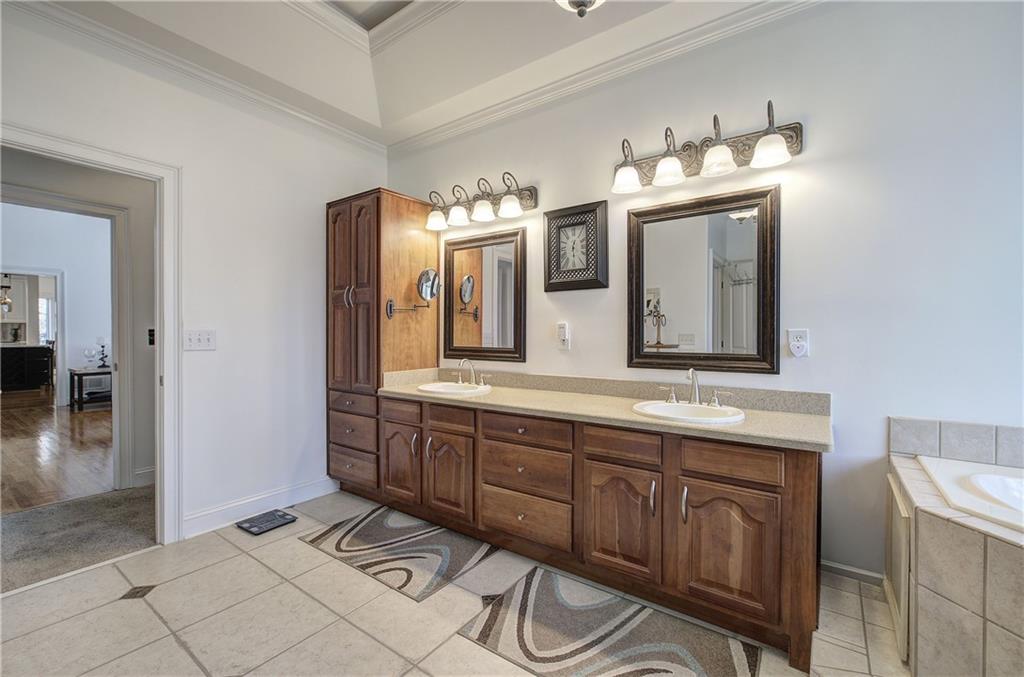 64 Fairview Court Jasper, GA 30143 - Photo 34 of 86 a spacious bathroom with a double vanity sink and a mirror