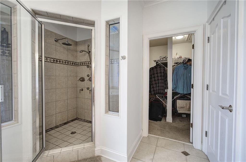64 Fairview Court Jasper, GA 30143 - Photo 35 of 86 a bathroom with a glass shower door and a bathroom