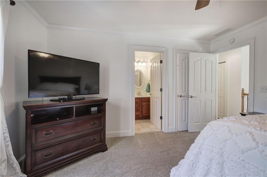 64 Fairview Court Jasper, GA 30143 - Photo 39 of 86 a bedroom with a bed and a flat screen tv