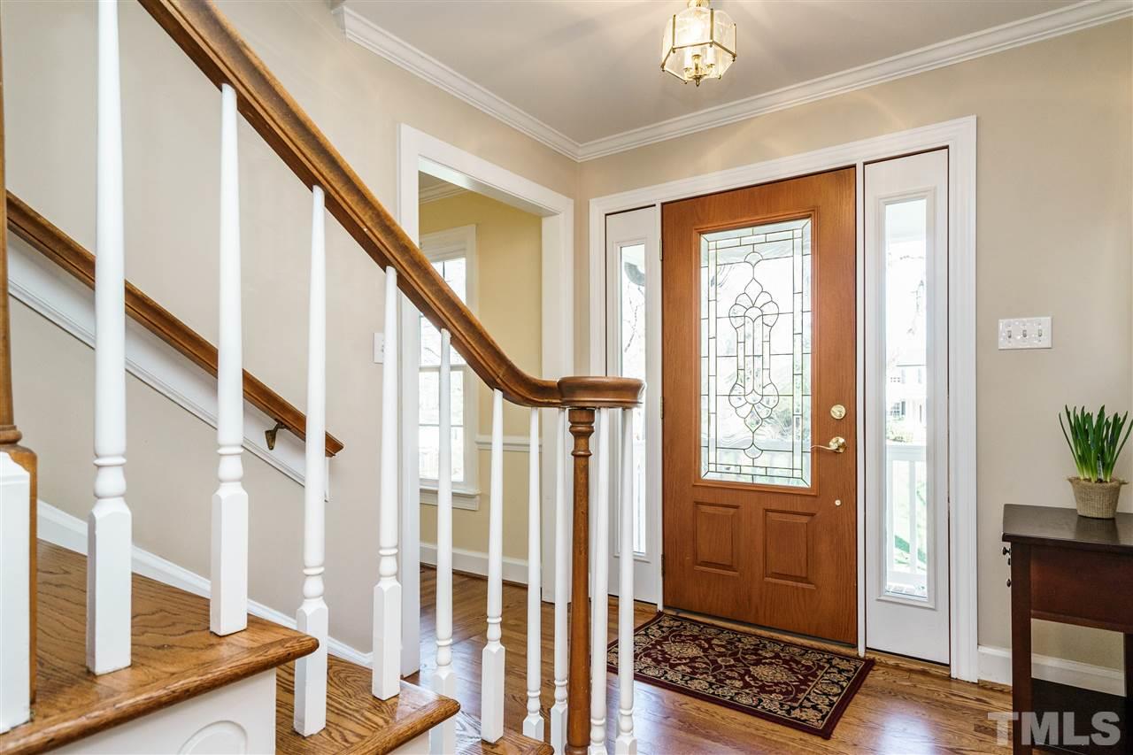 2212 Tyson Street Raleigh, NC 27612 - Photo 3 of 24 a view of an entryway with wooden floor and door