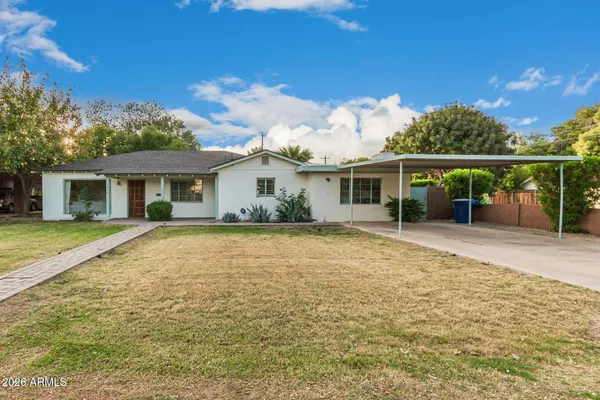 front view of a house with a yard
