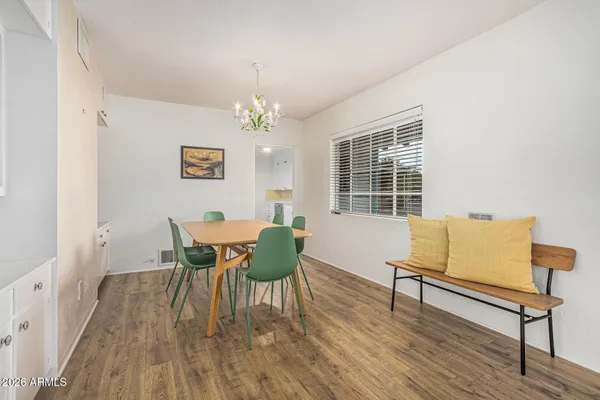 a view of a dining room with furniture and wooden floor