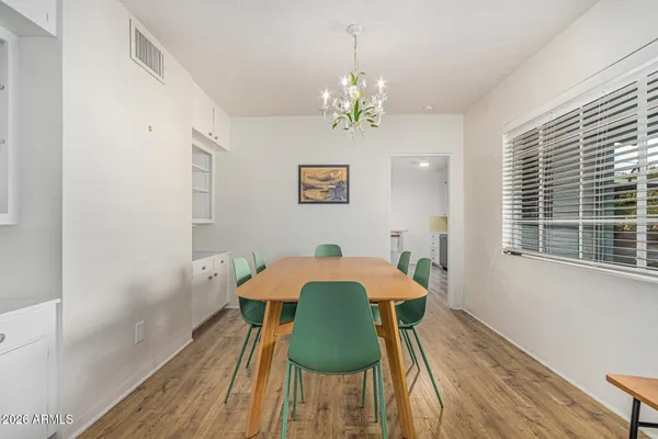 a view of a dining room with furniture window and wooden floor