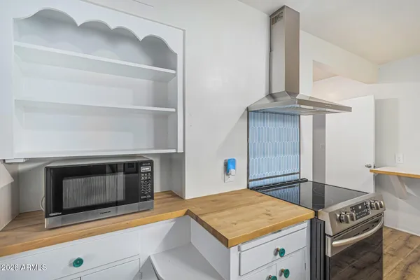 a kitchen with a stove and a sink