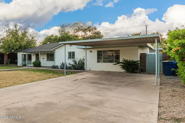 front view of a house with a yard