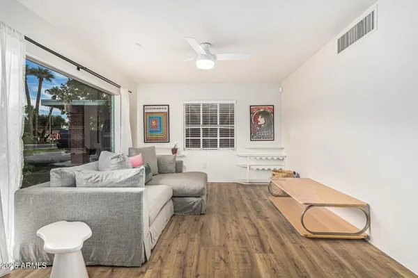 a living room with furniture and a large window