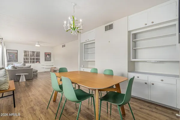 a view of a dining room with furniture and wooden floor