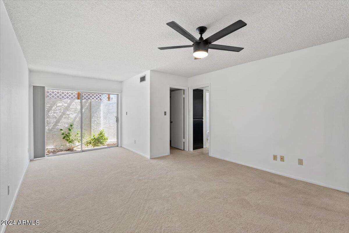 6105 North 12th Way Phoenix, AZ 85014 - Photo 19 of 29 a view of a livingroom with a ceiling fan and window