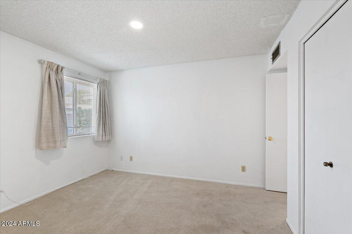 6105 North 12th Way Phoenix, AZ 85014 - Photo 25 of 29 a view of an empty room with a window