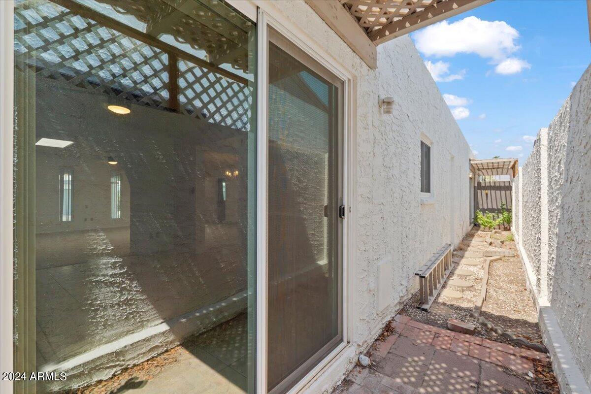 6105 North 12th Way Phoenix, AZ 85014 - Photo 27 of 29 a bathroom with a glass shower door and a glass door