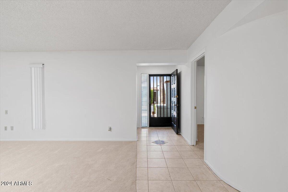 6105 North 12th Way Phoenix, AZ 85014 - Photo 3 of 29 a view of an empty room with a window