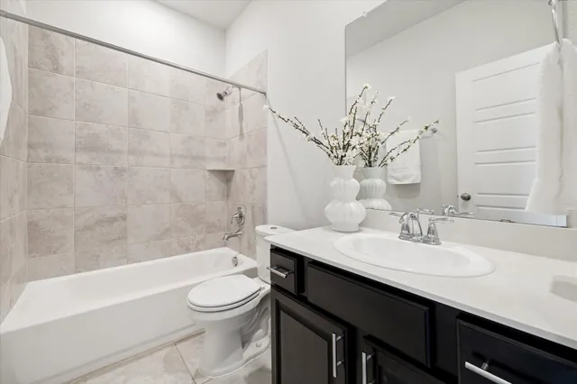 an empty room with closet and a chandelier fan