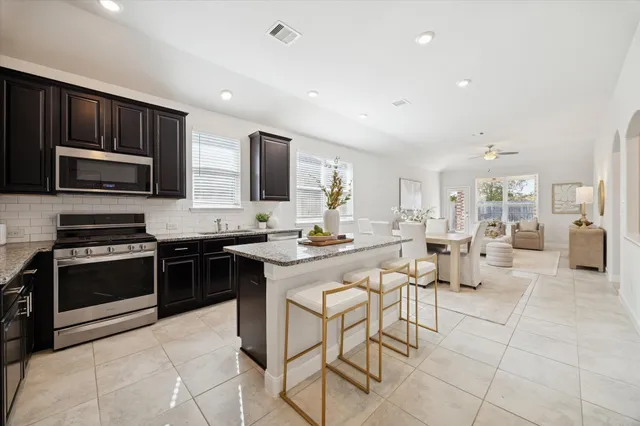 a large kitchen with cabinets