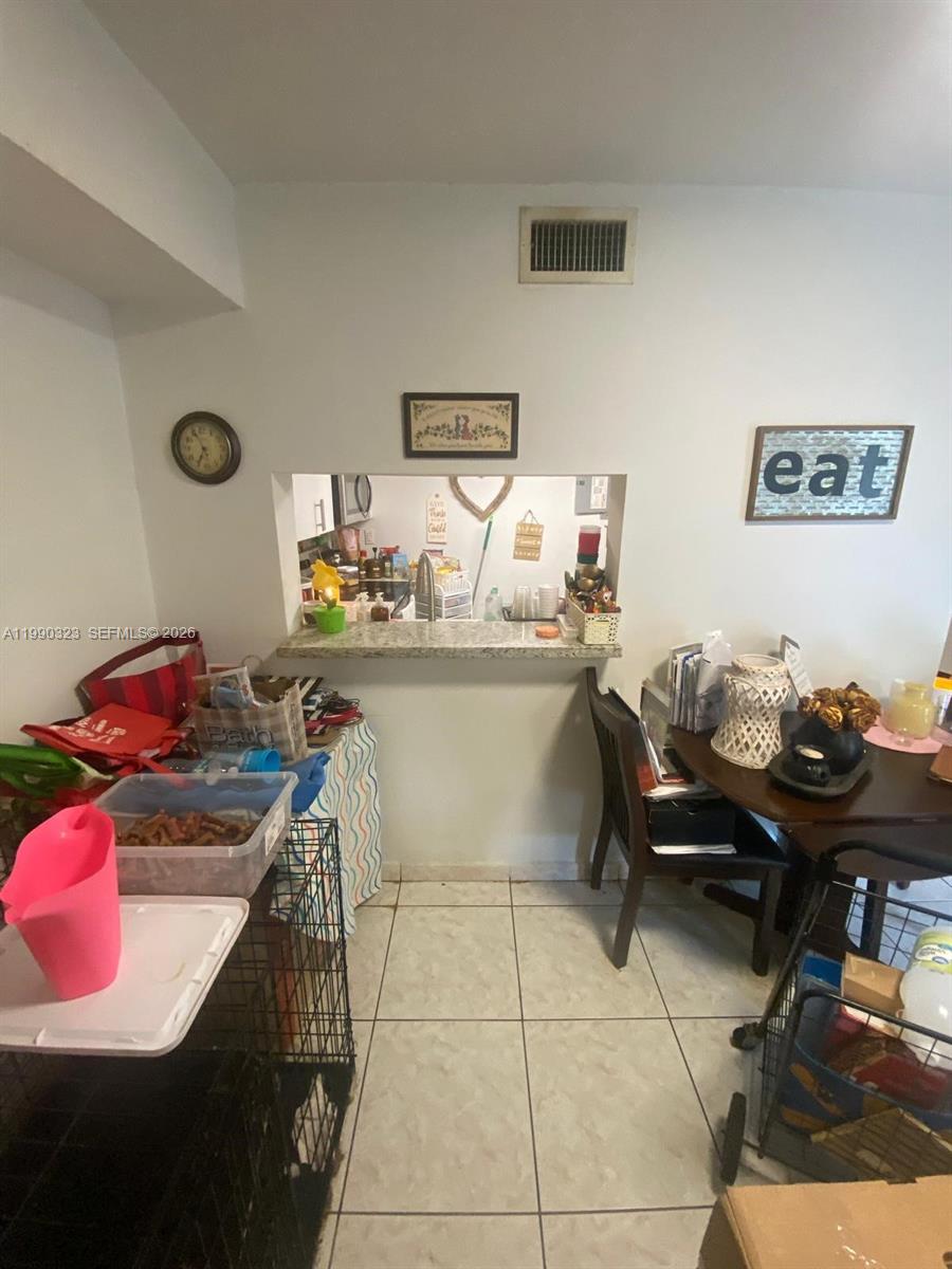 11800 Southwest 18th Street, Unit 1084 Miami, FL 33175 - Photo 15 of 30 a view of a workspace with furniture