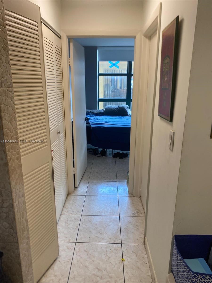 11800 Southwest 18th Street, Unit 1084 Miami, FL 33175 - Photo 16 of 30 a view of bedroom with a sink and a mirror