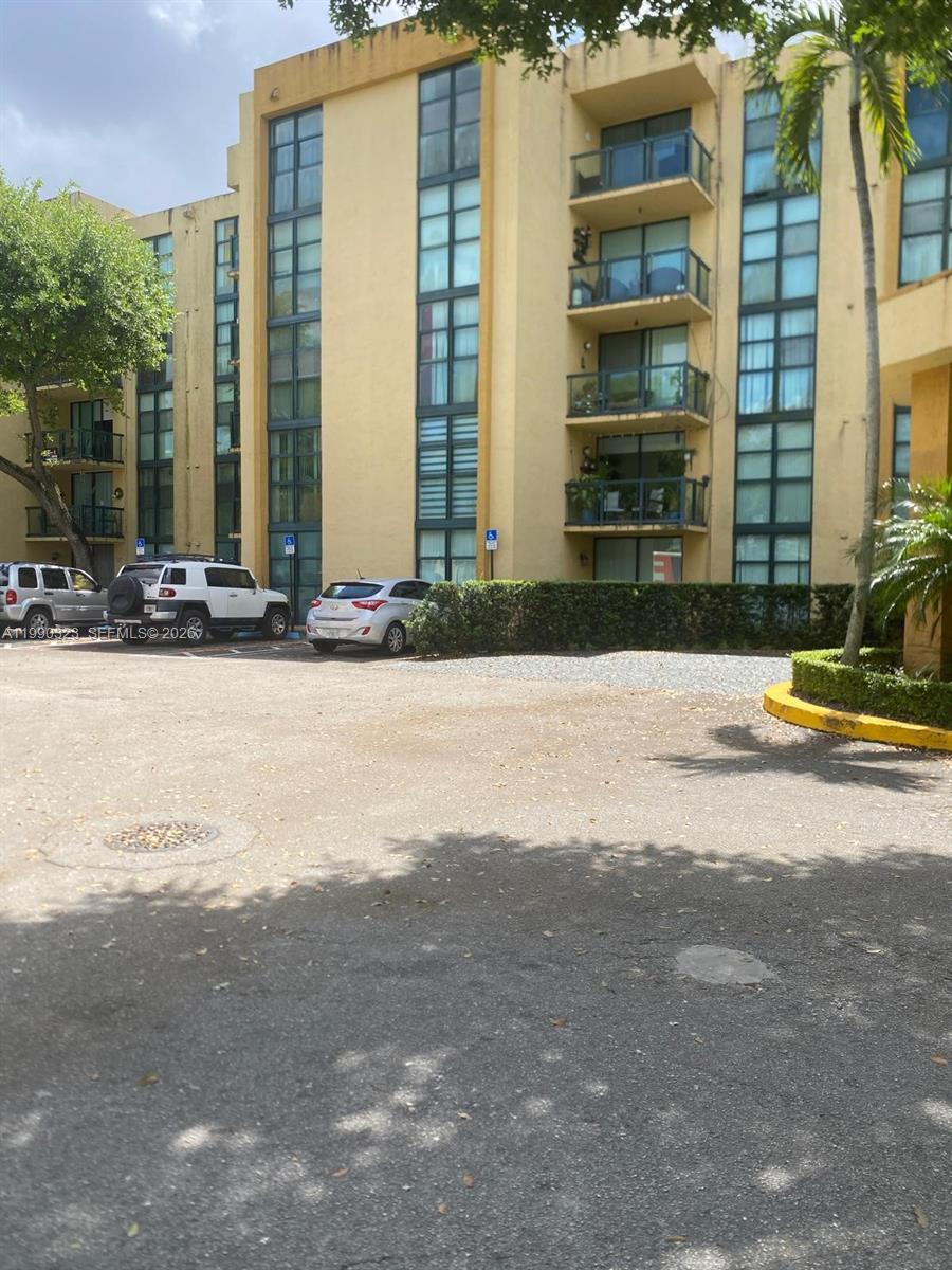 11800 Southwest 18th Street, Unit 1084 Miami, FL 33175 - Photo 2 of 30 a view of a building with a street