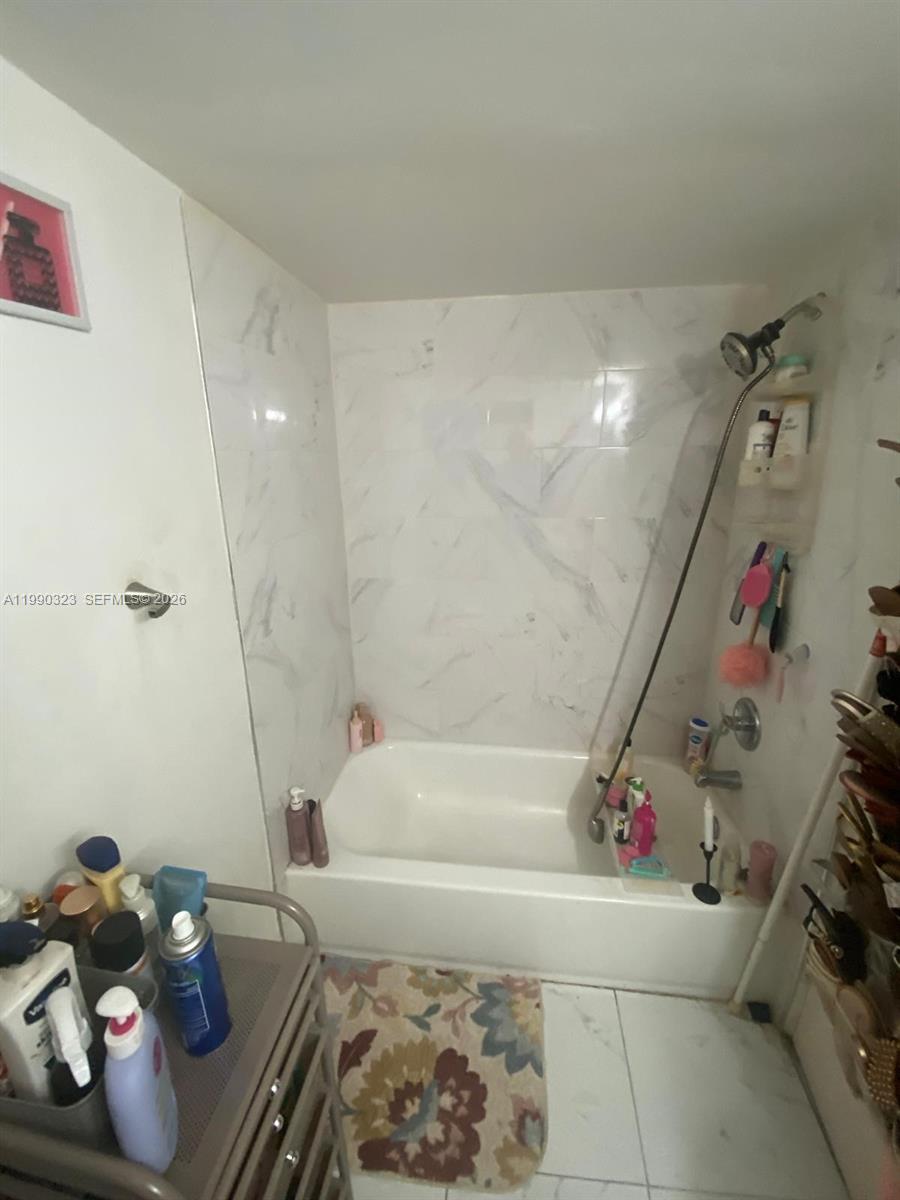 11800 Southwest 18th Street, Unit 1084 Miami, FL 33175 - Photo 26 of 30 a bathroom with a bathtub and shower