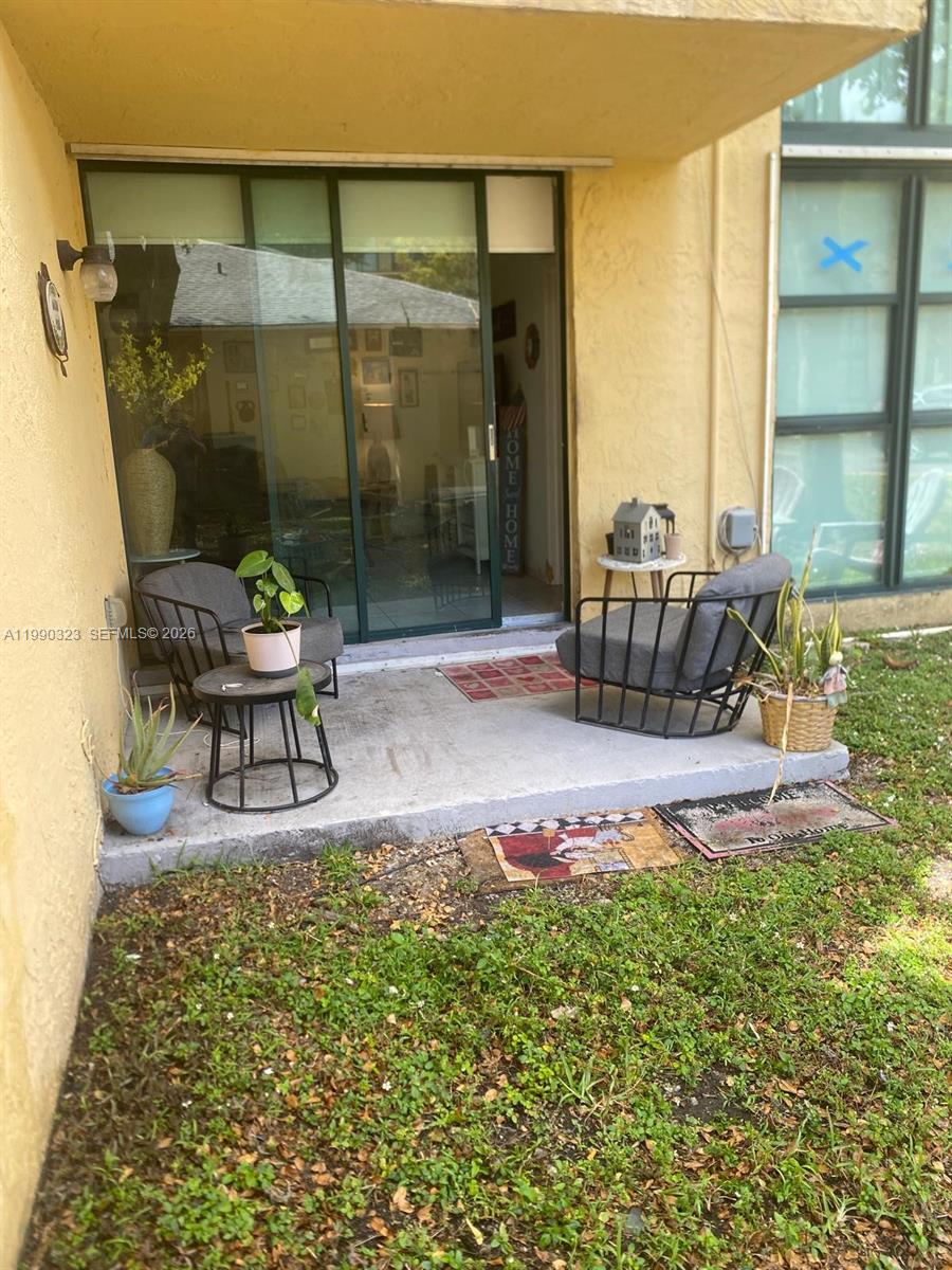 11800 Southwest 18th Street, Unit 1084 Miami, FL 33175 - Photo 30 of 30 a white bench sitting in a backyard of a house