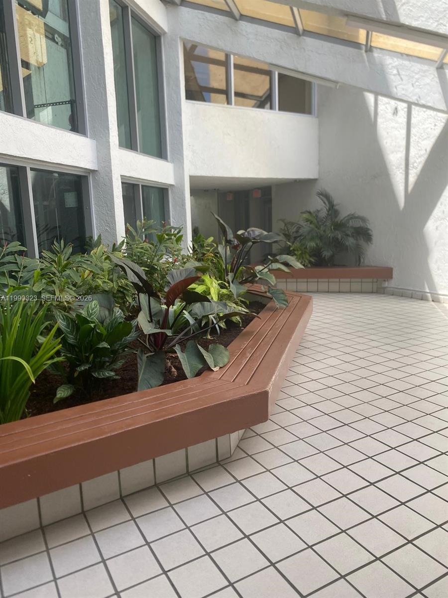 11800 Southwest 18th Street, Unit 1084 Miami, FL 33175 - Photo 4 of 30 a view of a house with a bench